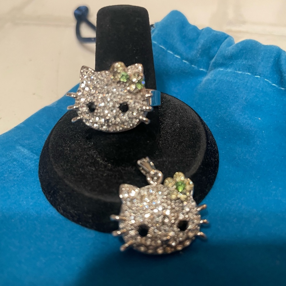 Hello Kitty Silver Adjustable Ring & Pendant. Kitty wears Green Hair Bow.